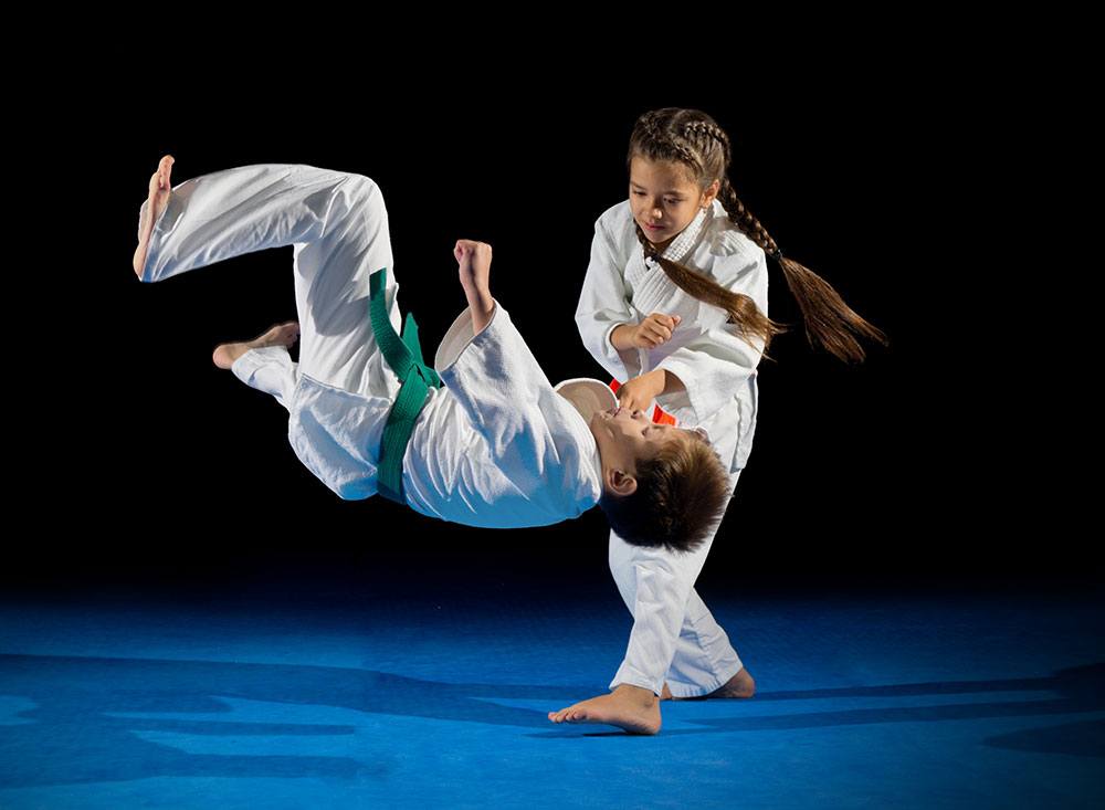 young kids practicing martial arts moves